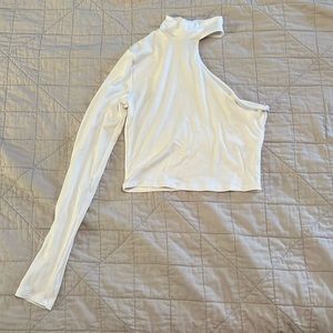 Long sleeve turtleneck with one shoulder.